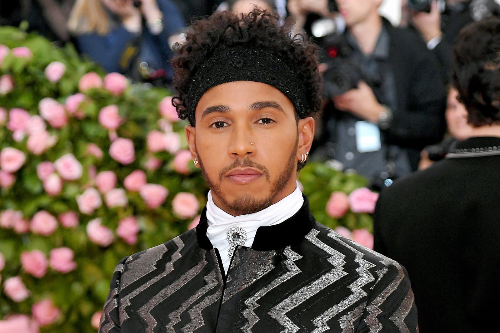 Lewis Hamilton wearing Alex Soldier’s ‘Astra’ pin with black and colourless diamonds in platinum