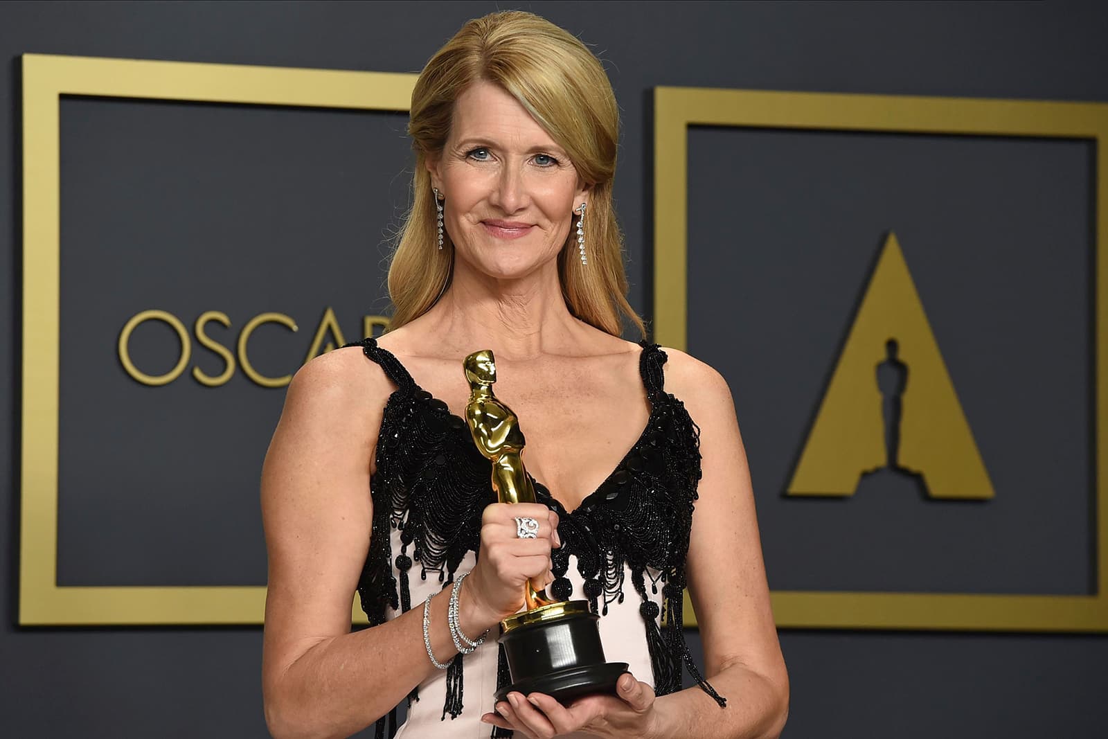 Laura Dern wearing Niwaka Fine Jewellery Renka earrings, Kuon and Kano bracelets and Karahana ring, all with diamonds in white gold