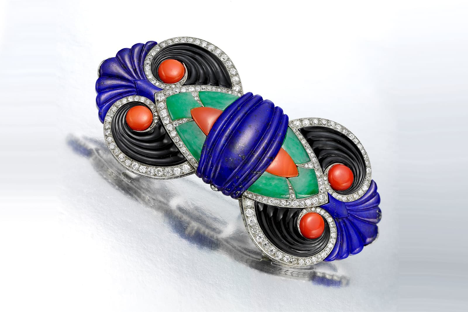  Offered by FD Gallery, Boucheron Art Deco devant de corsage brooch with lapis lazuli, coral, jade, onyx, and diamonds in platinum, circa 1925