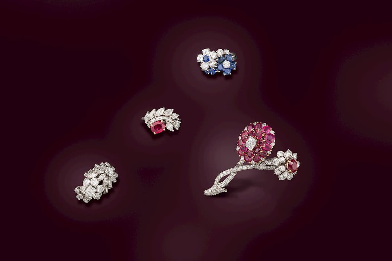  Offered by S.J. Phillips, a selection of jewels by Cartier with rubies, sapphires and diamonds in platinum 