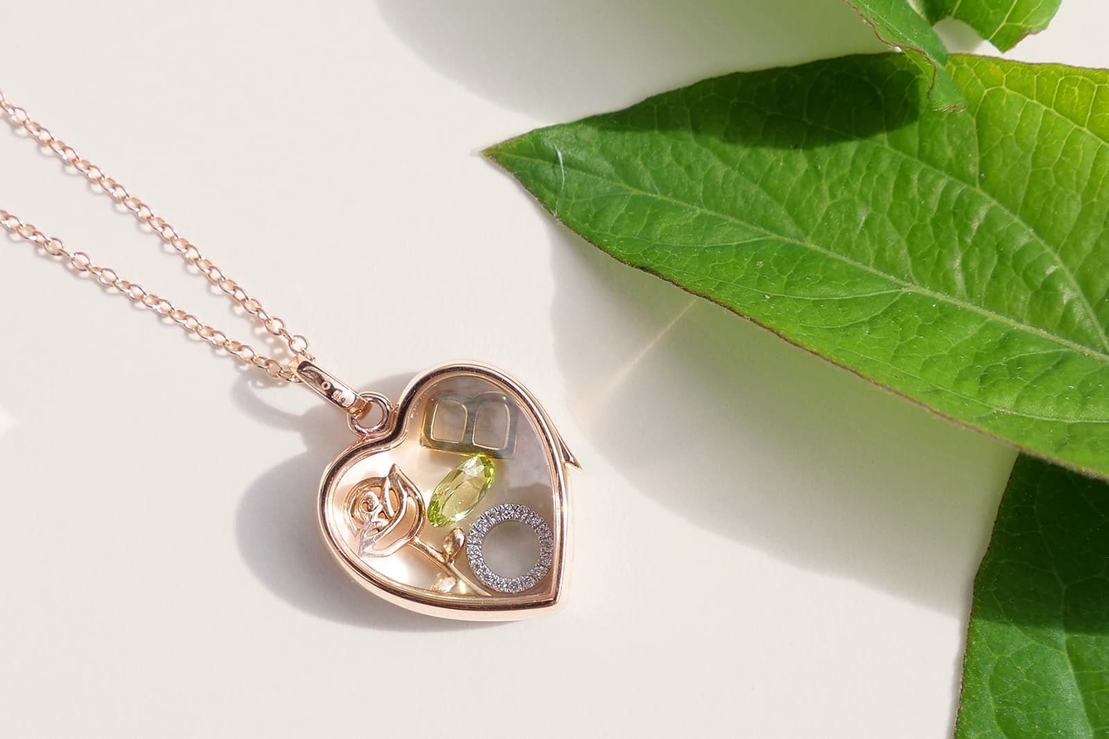 Loquet pendant with sapphire glass and multi-gemstone charms in rose gold