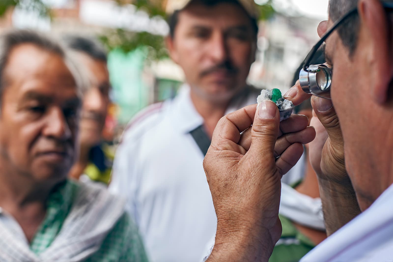  IEEX Colombian emerald rough being examined