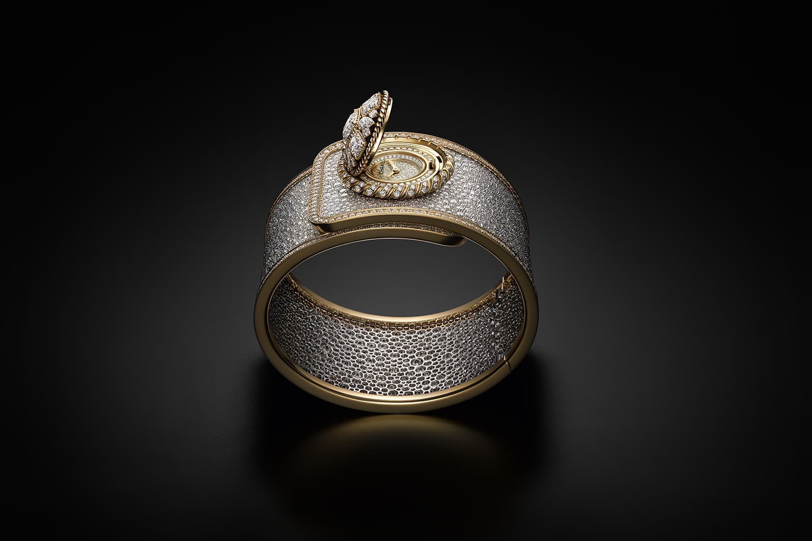  A magnificent Byzantine motif adorned with diamonds opens to reveal the hidden dial