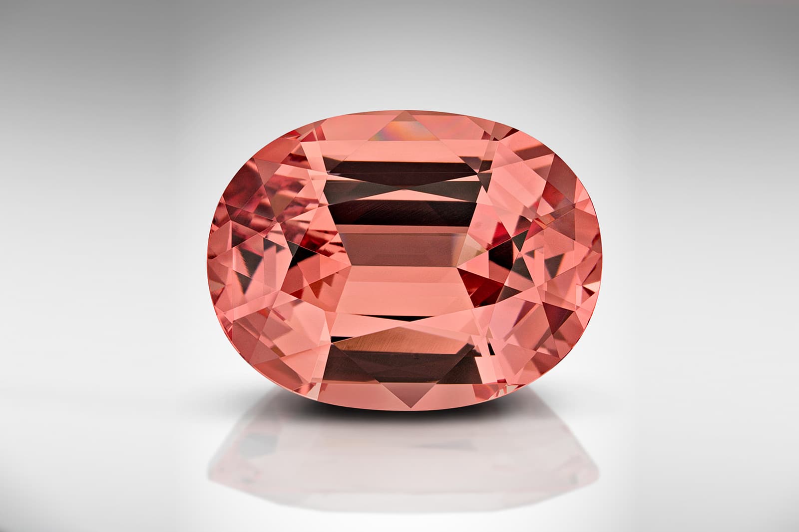  With its beautiful pinkish orange hue, this 8.45-carat Malaya garnet from Tanzania is exquisite