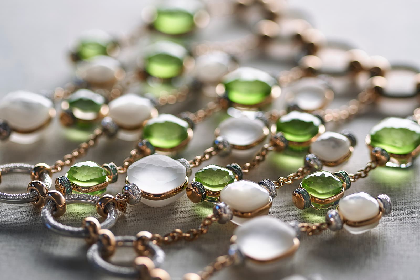   Another Nudo Cascade necklace pairs peridot and white topaz,  accented with tsavorite garnets