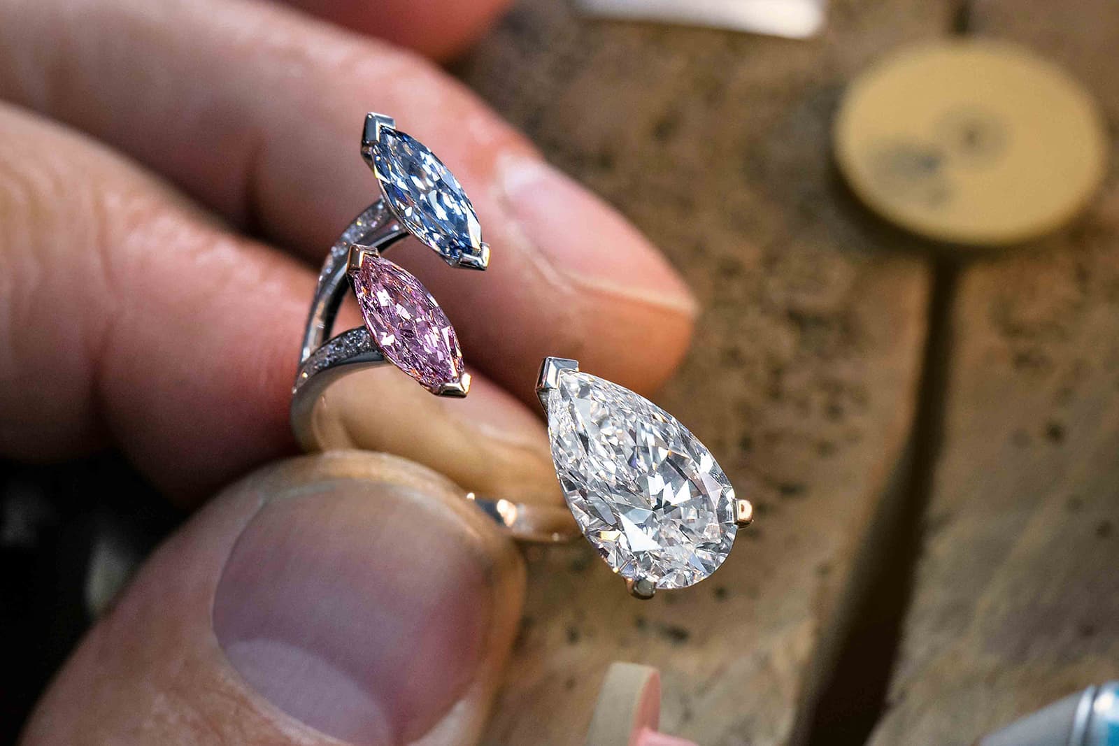  The Voltige Acrobates trio ring features a beautiful pairing of two Fancy Colour diamonds:  a 0.70 carat blue stone and a 0.73 carat pink diamond