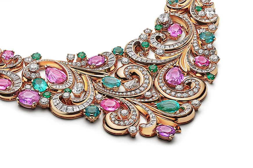 The elaborate invisibly set diamond flourishes are emblematic of the Baroque era