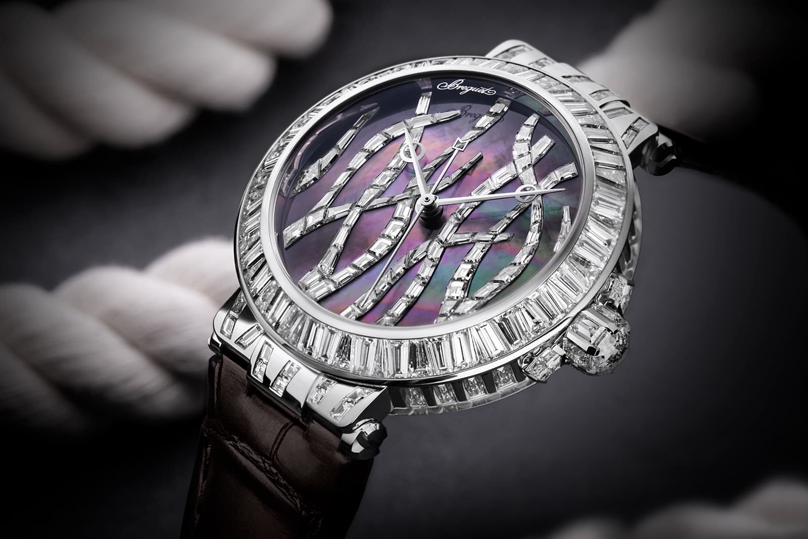  The all-diamond version incorporates colour through the Tahitian mother-of-pearl marquetry dial