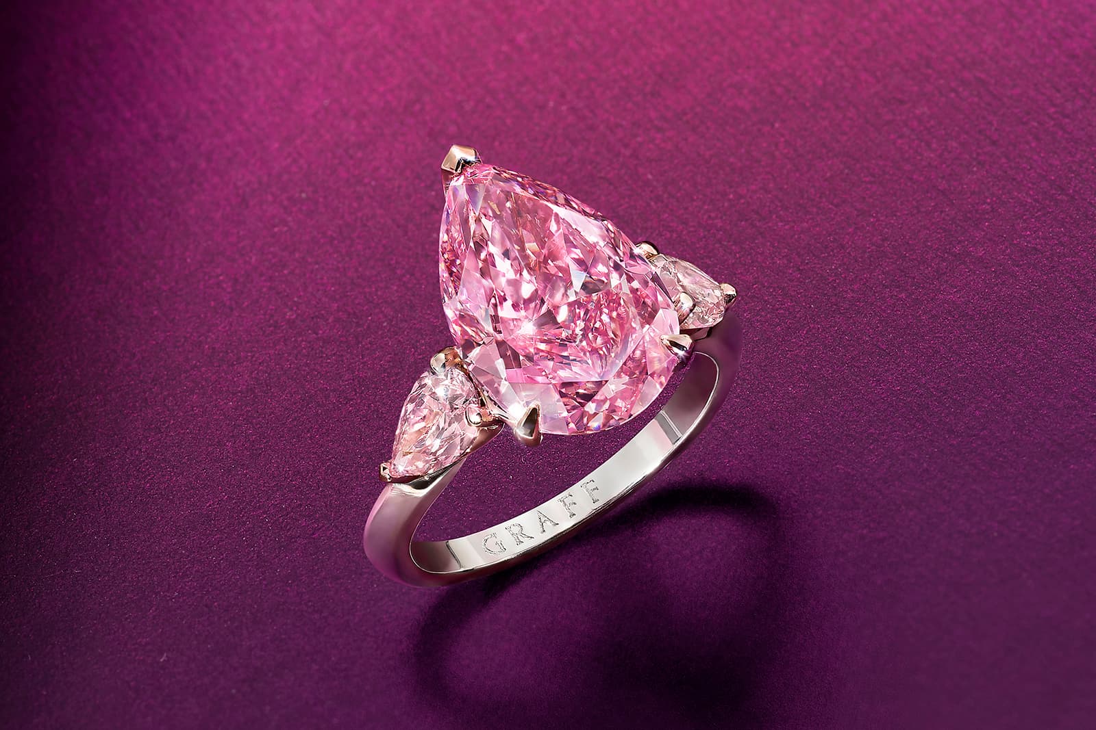 The 5.63 carat Fancy Vivid Purplish Pink pear shape diamond displays an incredibly rich and intense depth of colour