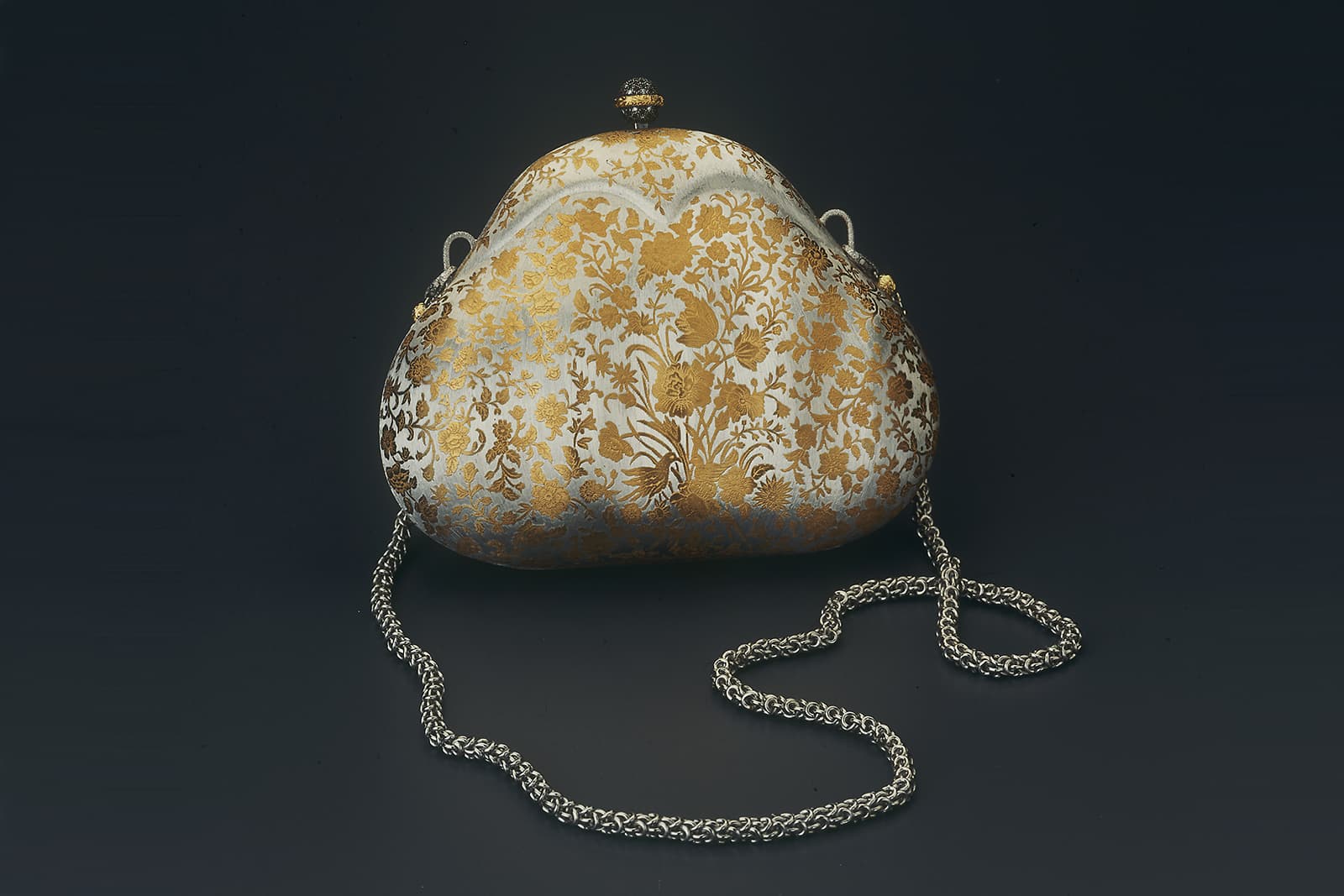 Buccellati clutch bag in rigato-engraved silver with golden flowers and engraved leaves, designed by Gianmaria Buccellati in 1980