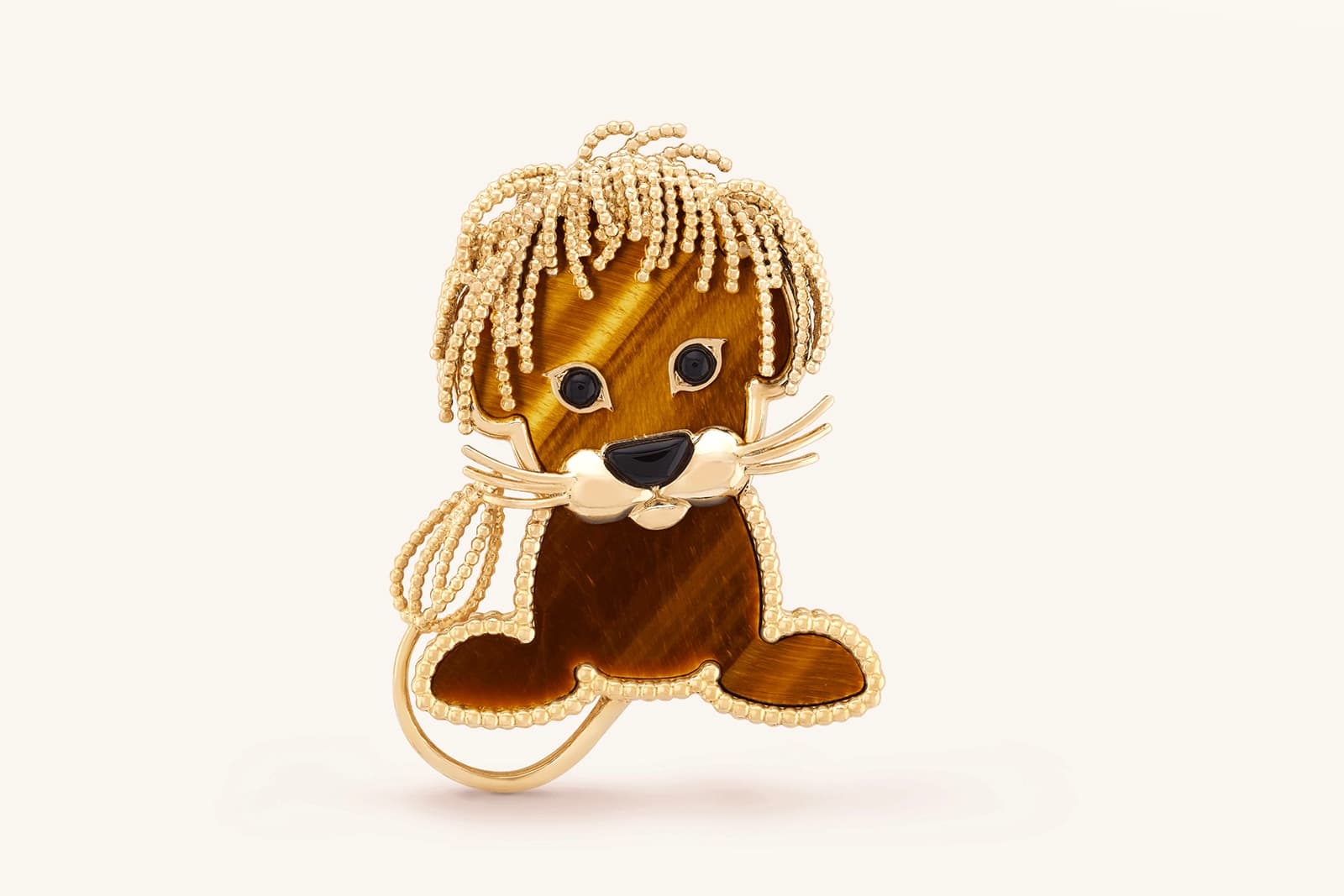 Van Cleef & Arpels' charming Lucky Animals Lion brooch in onyx, tiger's eye and 18 carat yellow gold