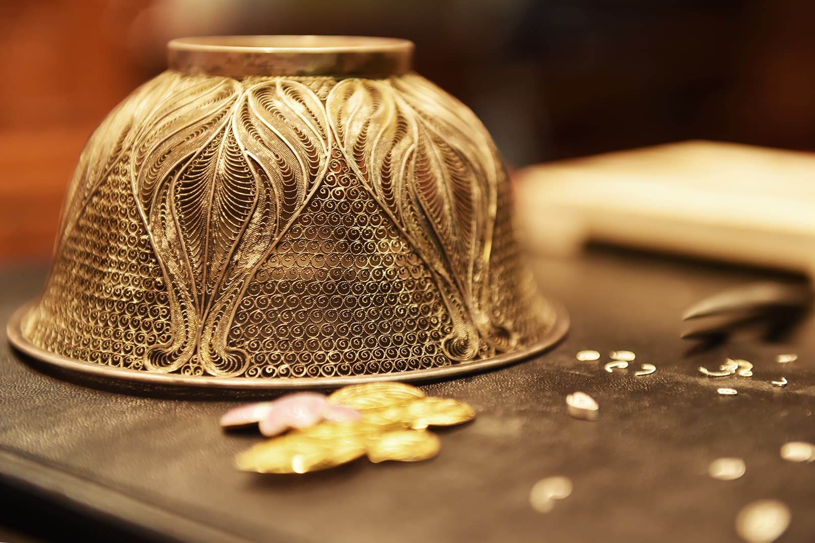 The technique involves delicate metalwork, soldering twisted threads of gold, silver or copper together and arranging them in artistic compositions before the gems are added
