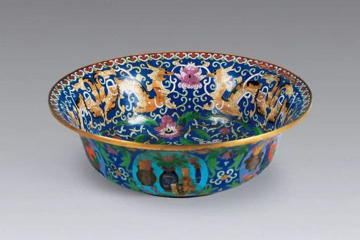 This cloisonné bowl features a distinctive dark-blue enamel known in Chinese as Jingtai blue