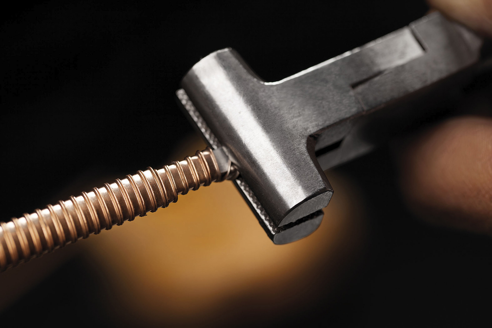 The bracelet is crafted by braiding wires of precious metals around a wooden or copper armature 