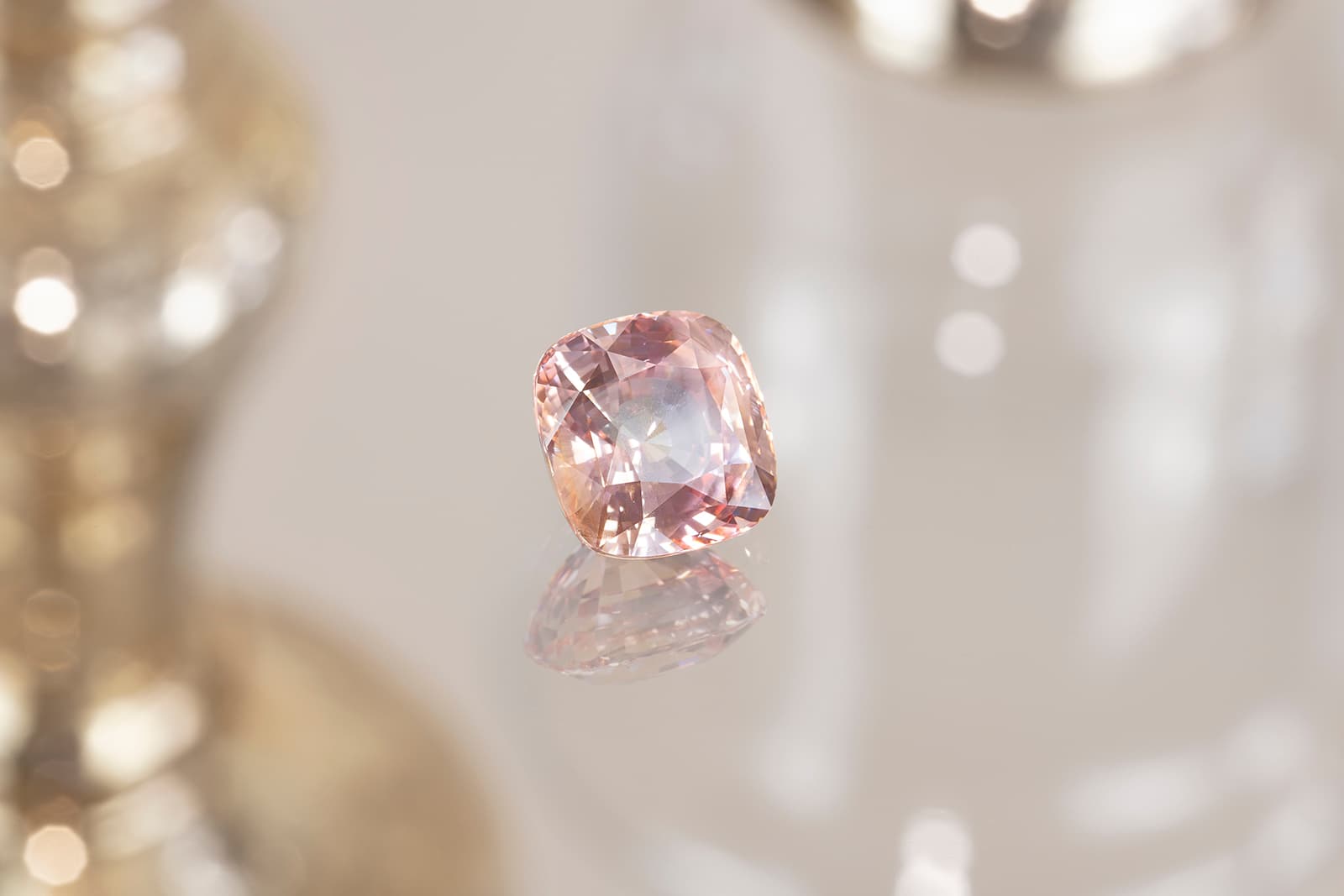 An exquisite 14.25 carat cushion cut Sri Lankan Padparadscha sapphire