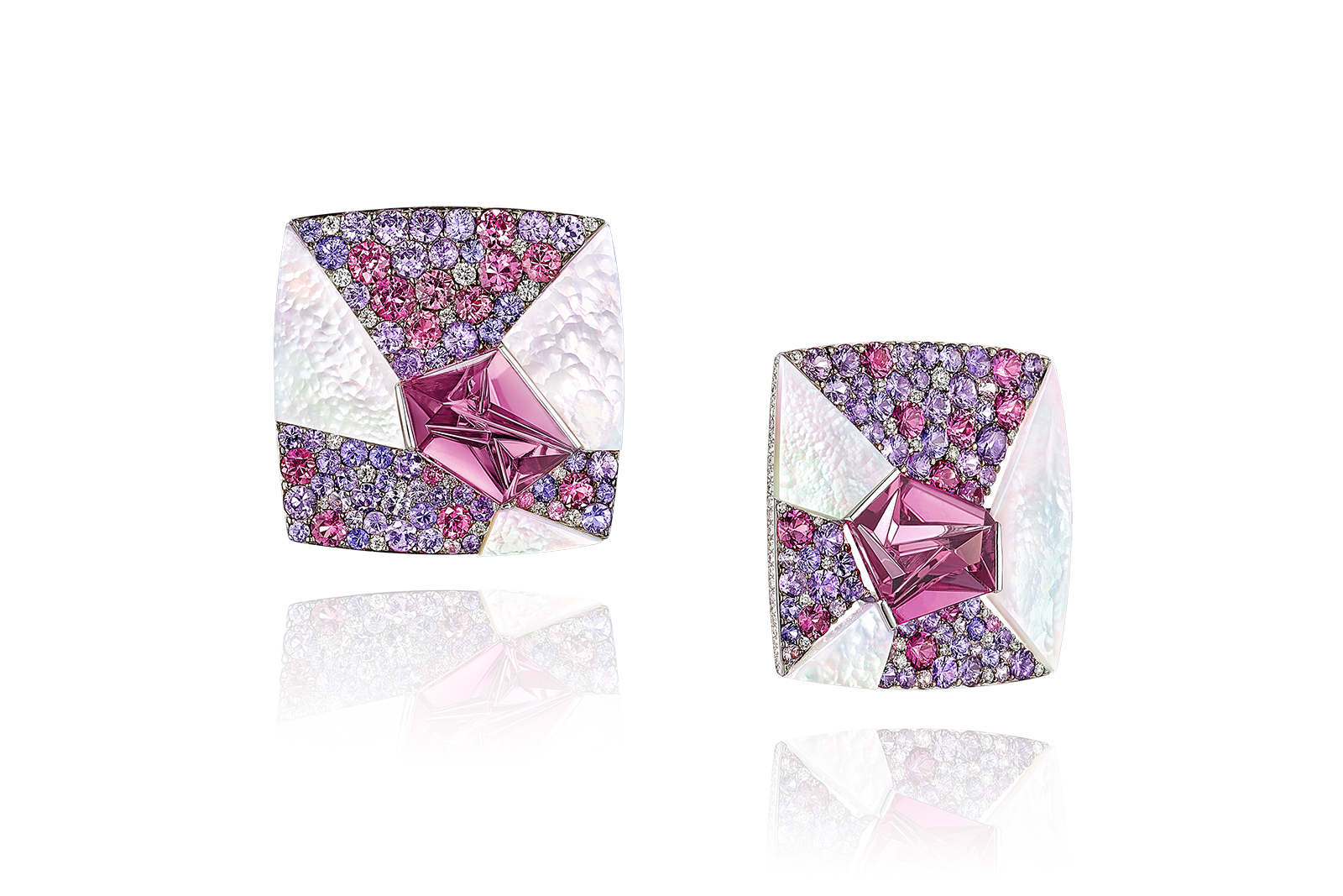  The tourmalines are complemented by a dynamic pattern of pavé pink and purple sapphires, interspersed with angular slices of shimmering mother-of-pearl