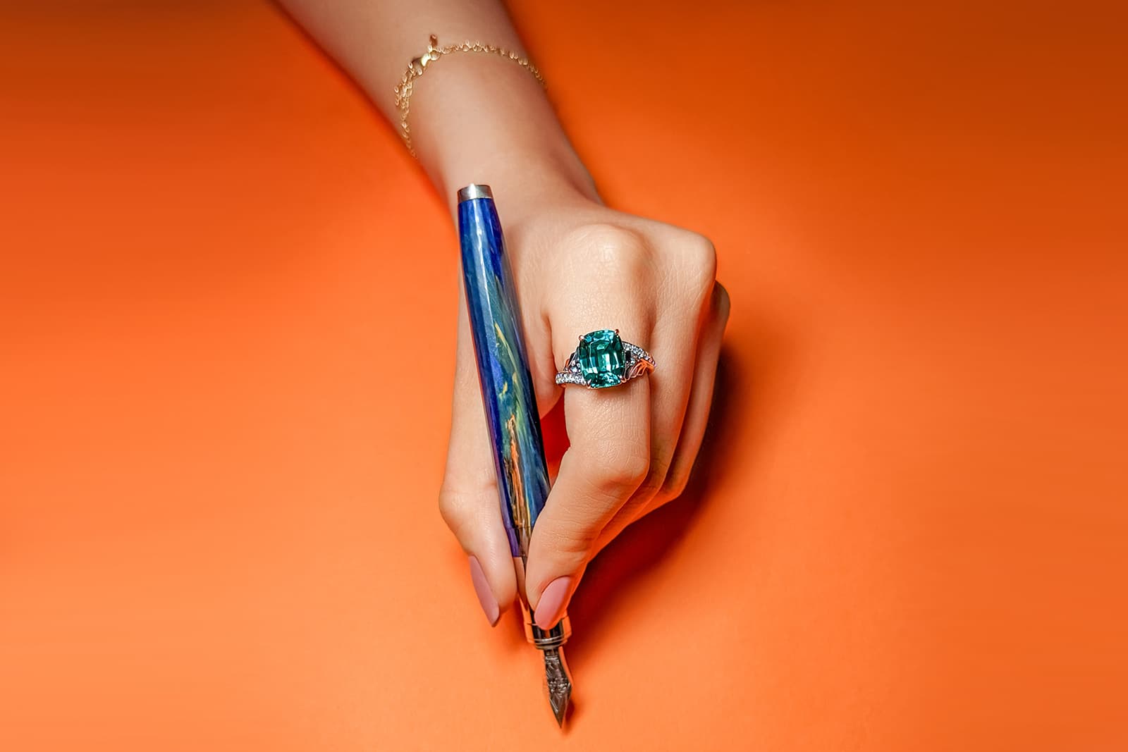 Madly ring set with a richly hued Indicolite tourmaline flanked by pear shape colour-change garnets