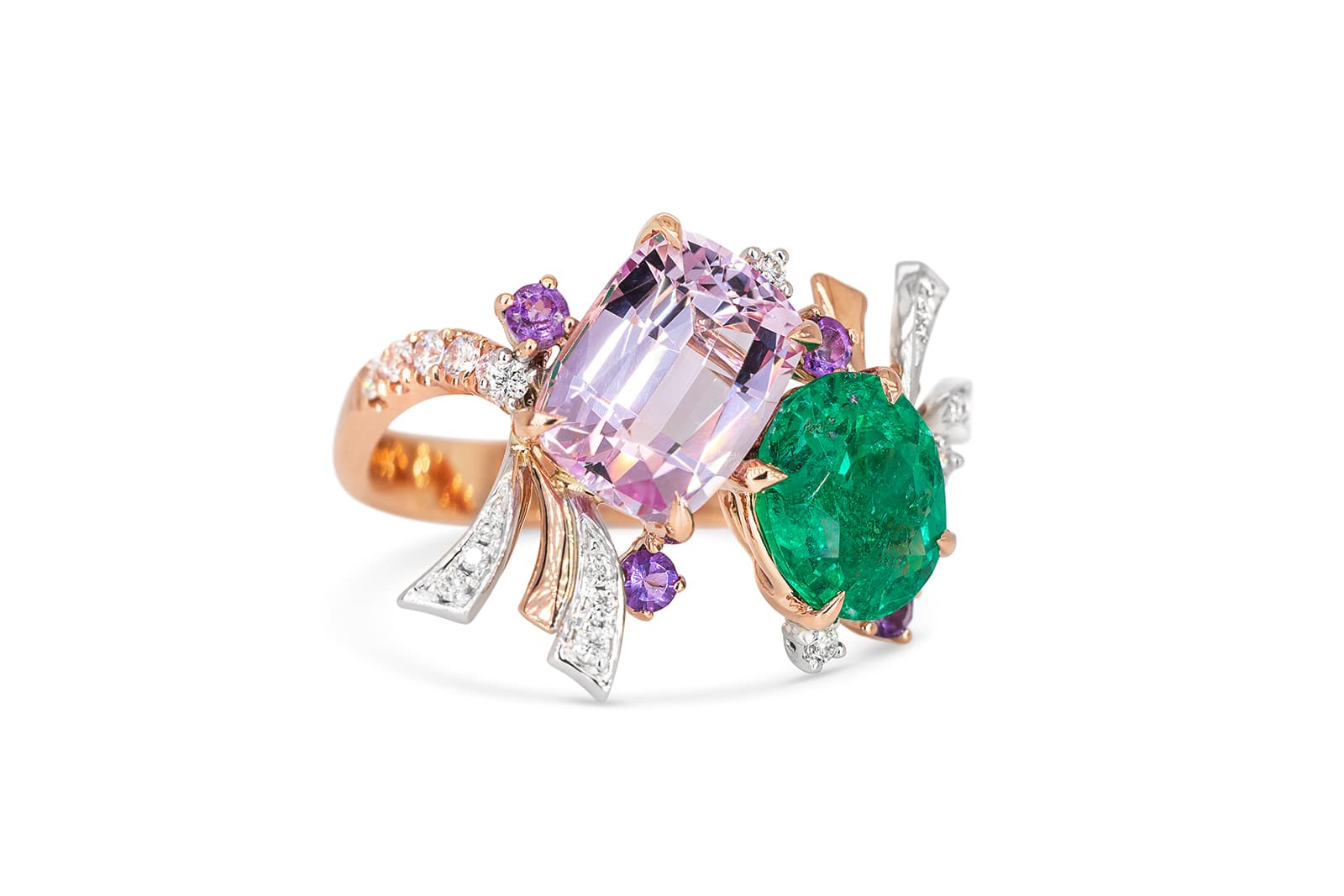  A bespoke Madly bird’s nest-inspired family ring set with an emerald, pink topaz and diamonds