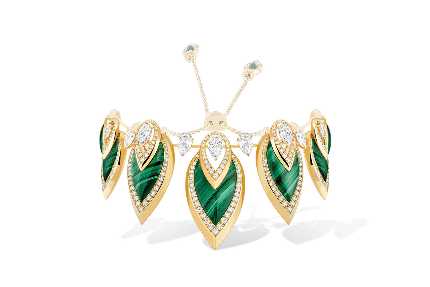  The set also includes a striking malachite and diamond bracelet