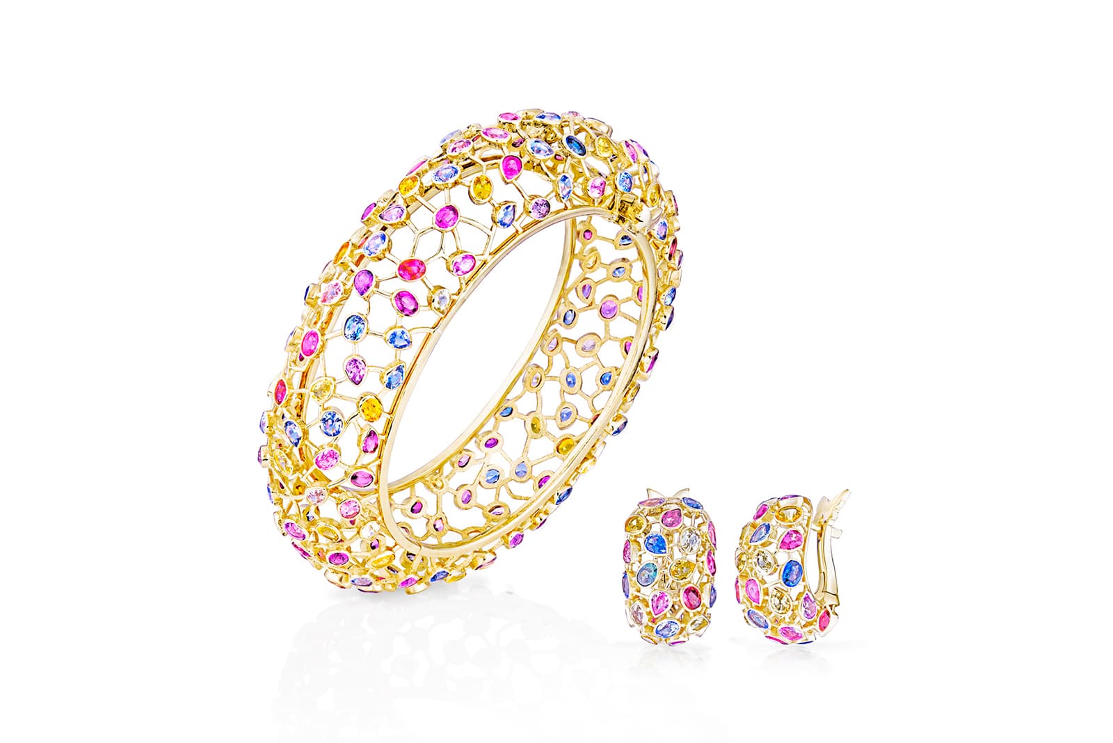  The bracelet and earrings feature an array of pink, blue, yellow and white sapphires