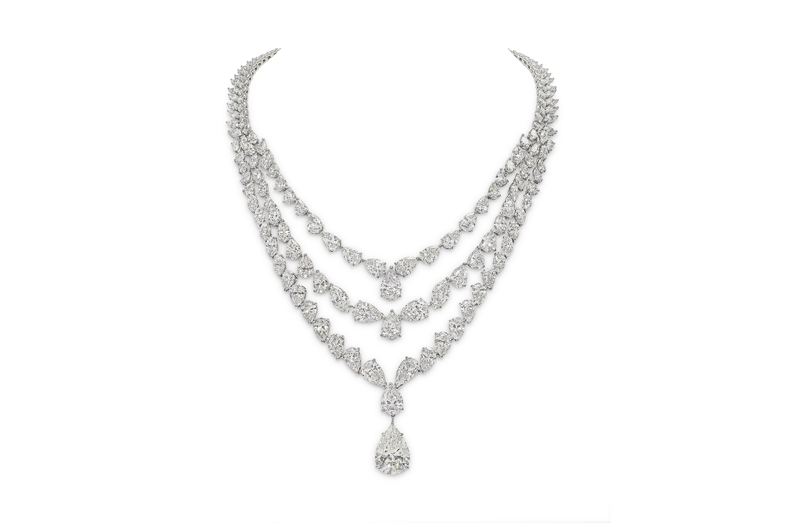  Suspended beneath is a sensational 12.45-carat pear shape diamond drop