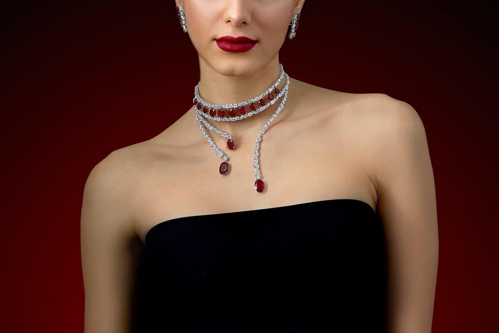 A contemporary choker-style necklace by Jahan set with 14 exceptional quality Burmese rubies and diamonds