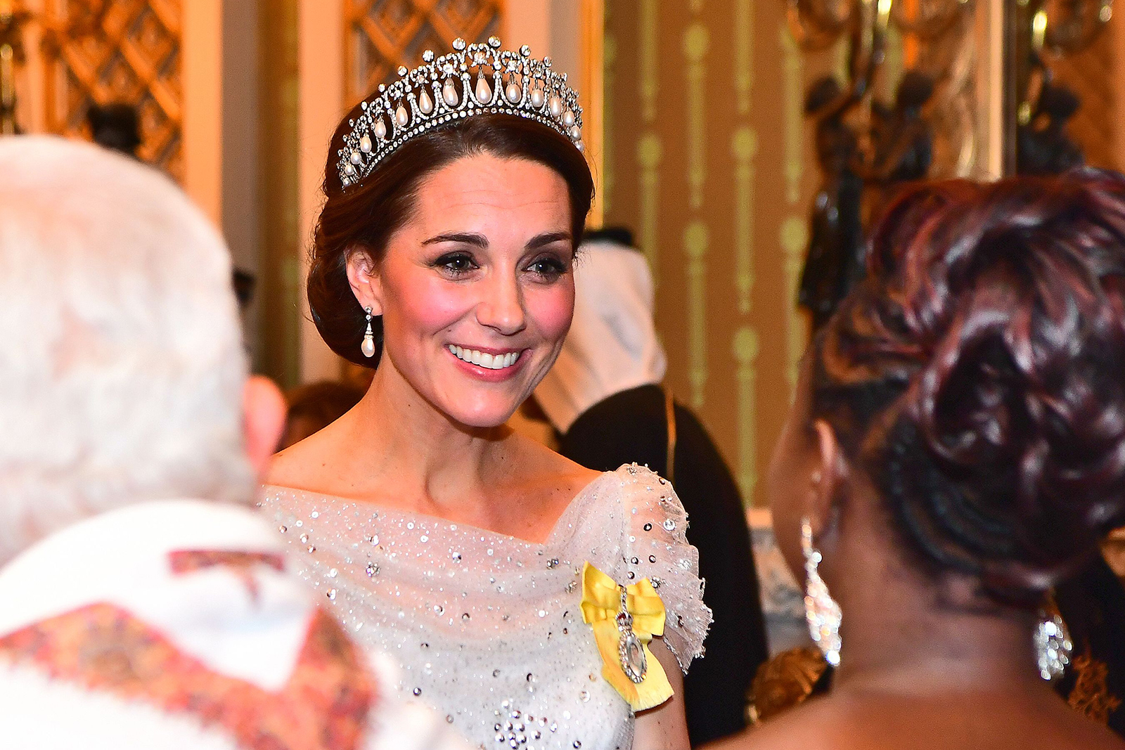  As royal protocol dictates, Kate wears tiaras for white tie events. Here she is pictured wearing the Lover's Knot tiara