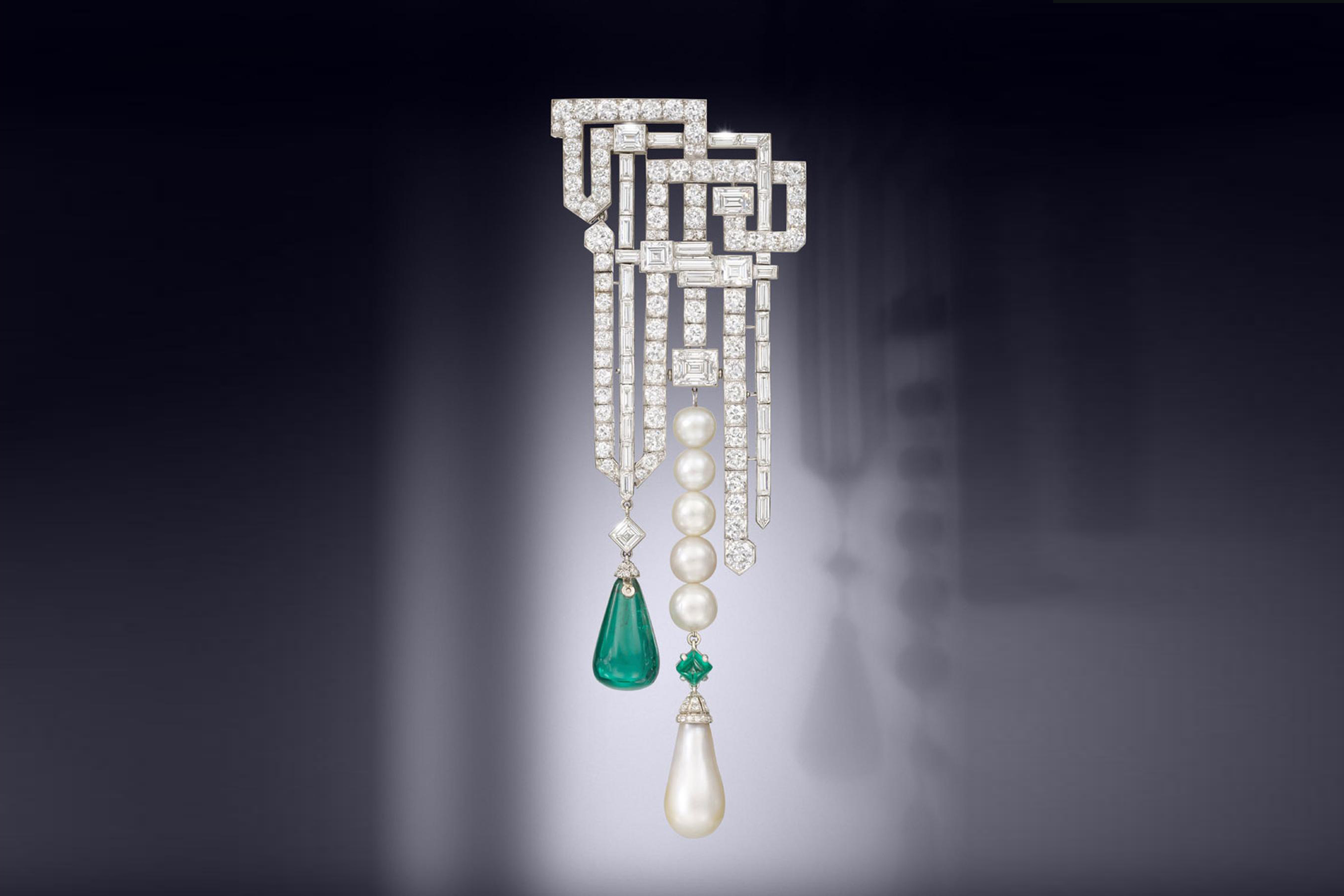 A rare Art Deco natural pearl, emerald and diamond brooch by Van Cleef & Arpels, 1926. Courtesy of Bonhams