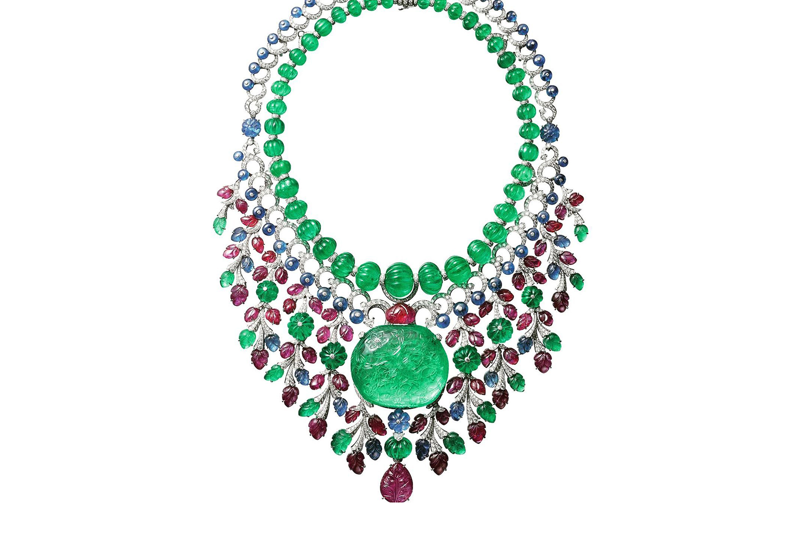  A modern rendition of the iconic Cartier Tutti Frutti necklace, set with a 137 carat carved antique Colombian emerald, created in 2016