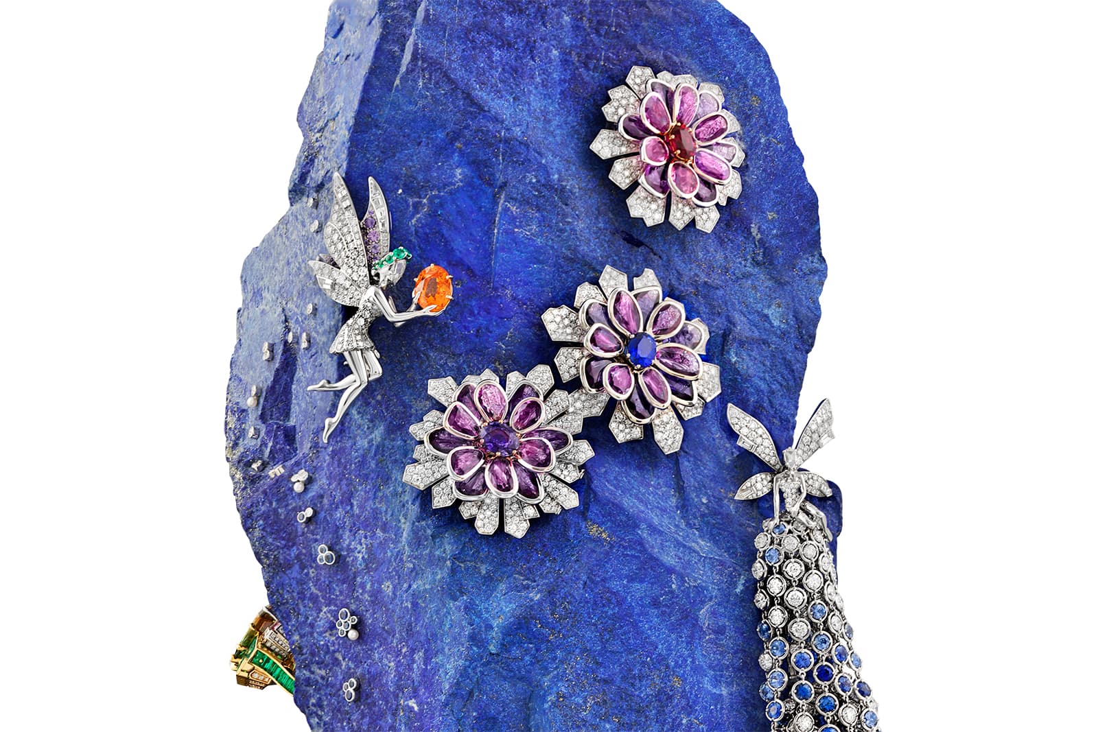  Two Van Cleef & Arpels fairies sit daintily upon the lapis lazuli rock, which blooms with gem-set Oleander flowers