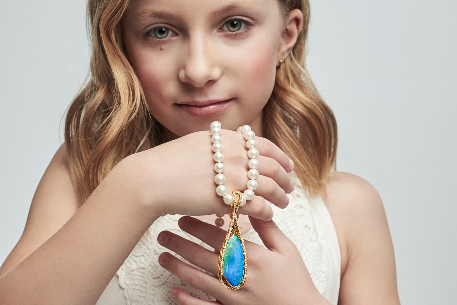 Opal Minded Blue Symphony pendant, set with an elegant royal boulder opal, strung from a pearl necklace