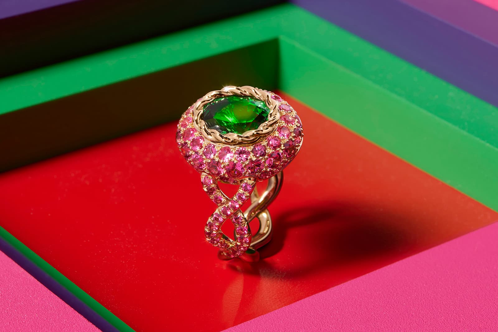  Each ring is designed so that the large centre stone appears to be buried in a pavé of smaller gems