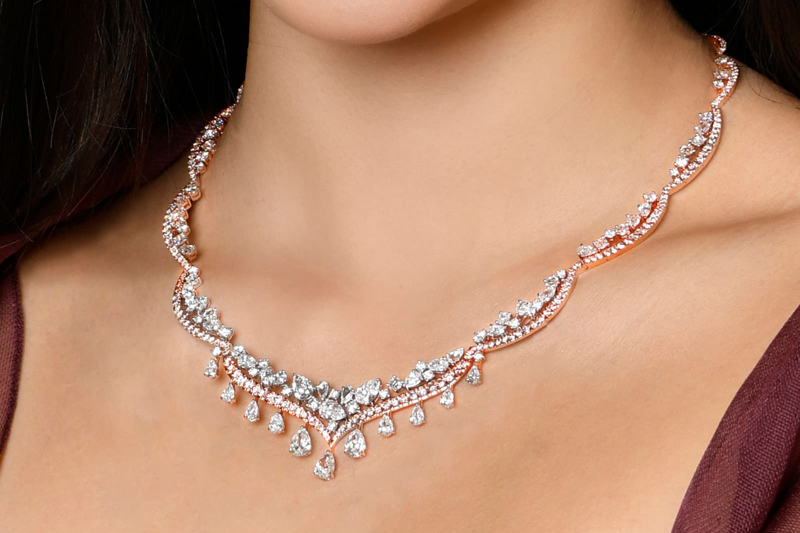  The necklace is convertible and can be worn with just one layer of pink and white diamonds