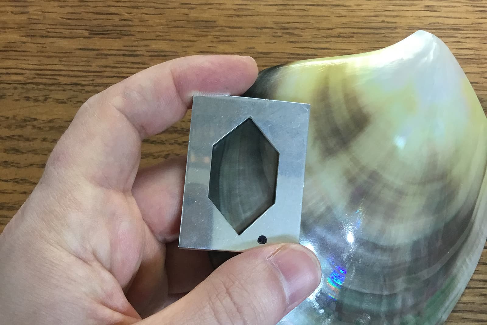  Selecting the perfect piece of mother-of-pearl for the Winter Koi Pond brooch by David Michael