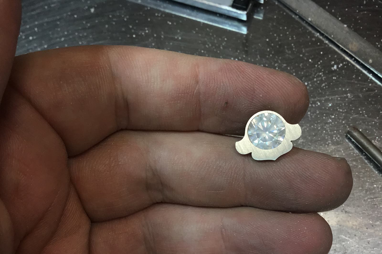 A round brilliant cut diamond destined for the Winter Koi Pond brooch, created by David Michael