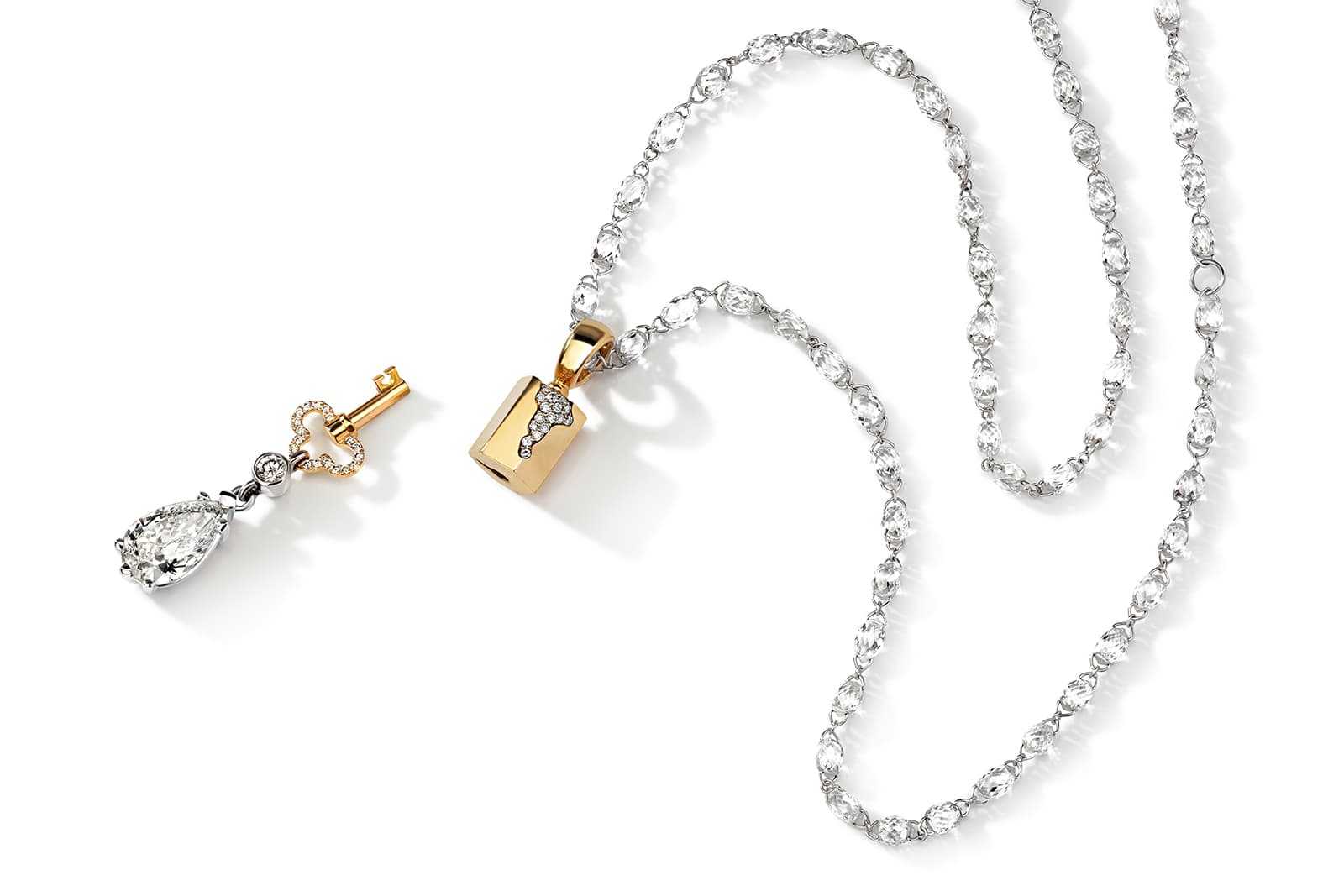  Liza Borzaya has created a key and lock mechanism that attaches charms to diamond sautoir necklaces