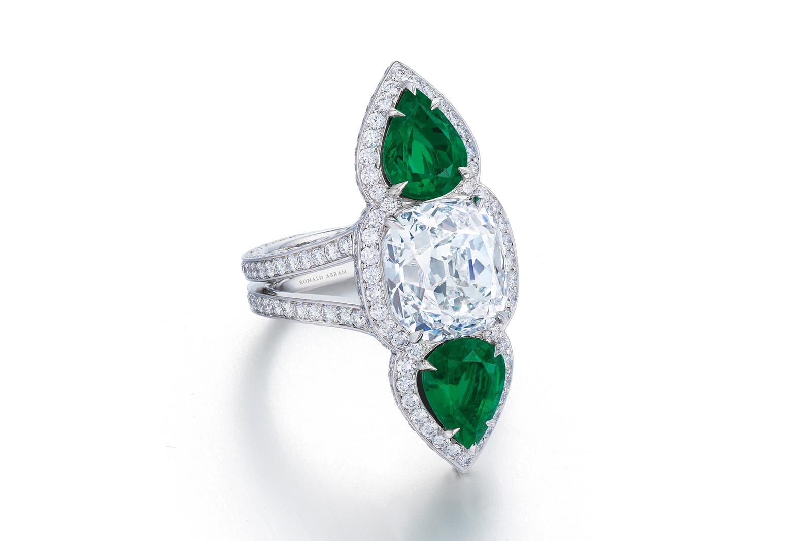  A cushion-cut diamond and Colombian emerald ring by Ronald Abram
