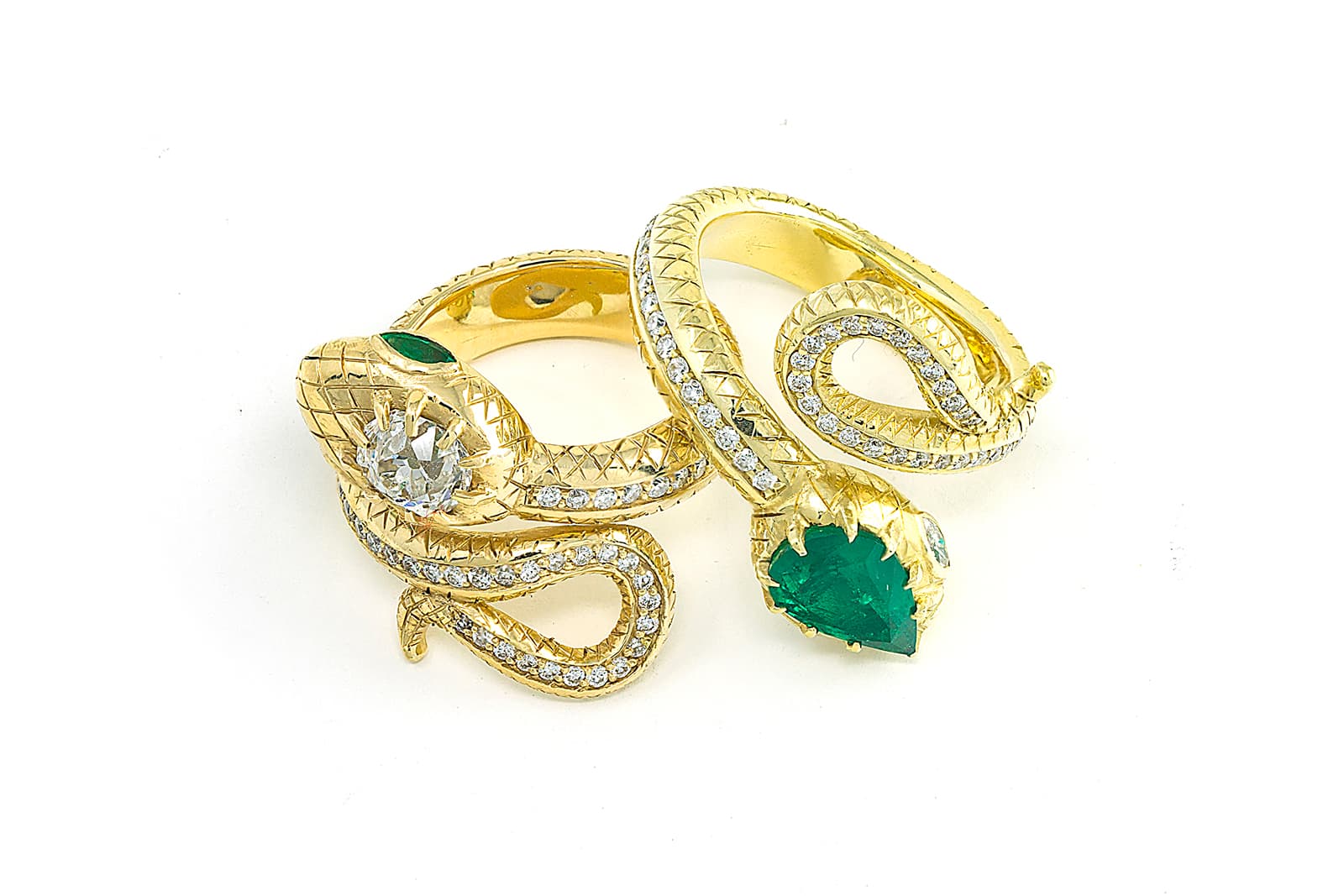 Two snake-inspired rings by Jenna Blake, including one with a 2 carat Muzo emerald (right)