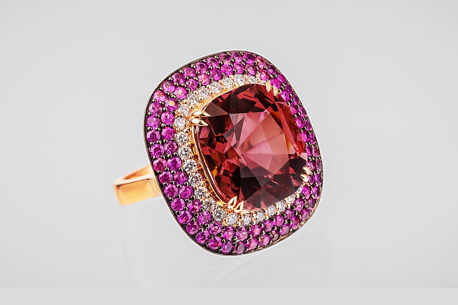  Alexander Laut cocktail ring with a central spinel surrounded by pink sapphires and diamonds