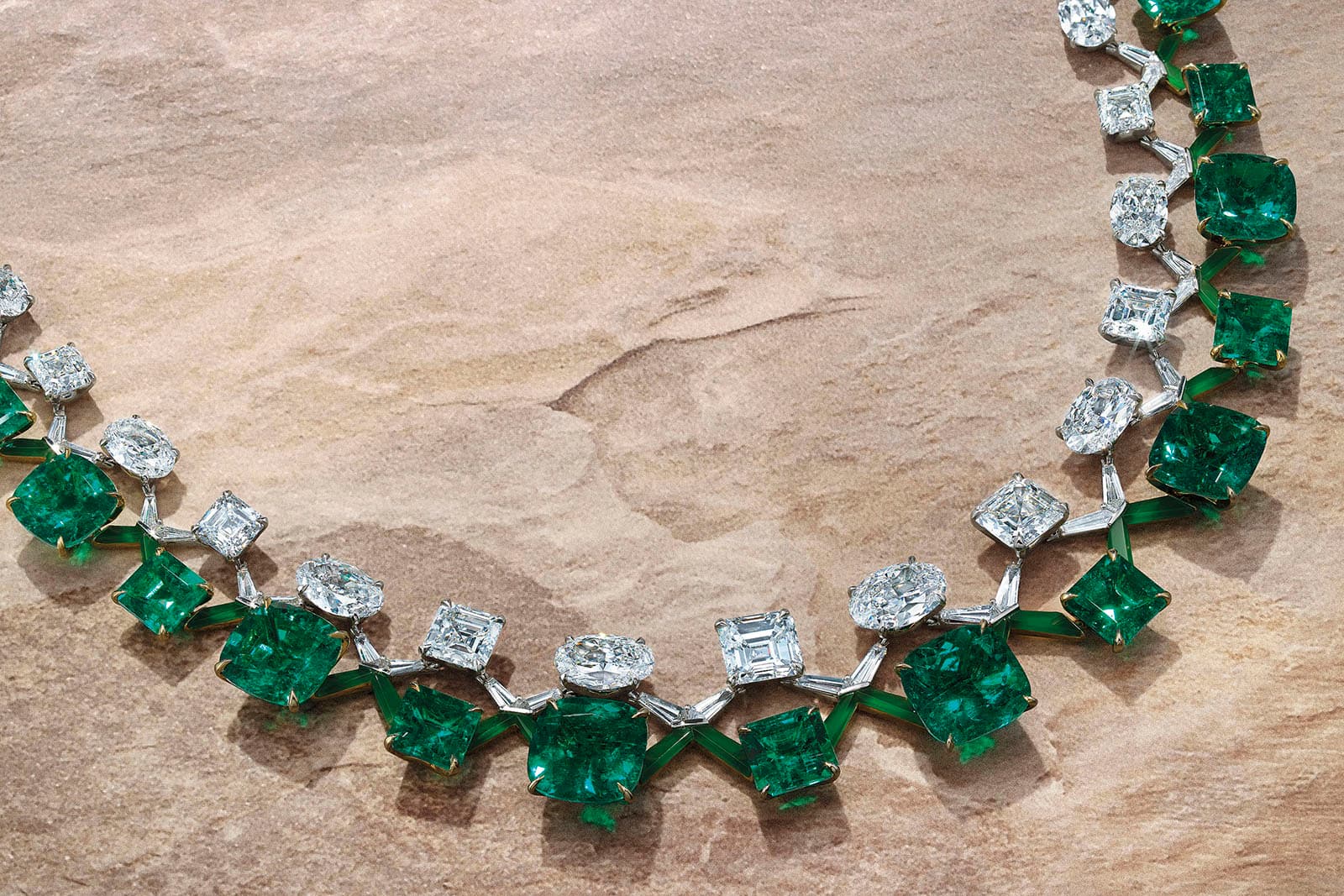 Twenty-eight cushion and octagonal-cut emeralds of 10.41 to 1.48 carats, twenty-two oval and rectangular-cut diamonds of 4.22 to 0.70 carats, vari-cut diamonds, fancy-cut jadeite, gold, inner circumference 40.0 cm, signed Boghossian, designed by Edmond Chin, white Boghossian case