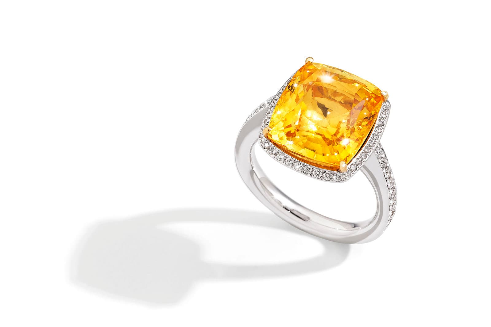  At the heart of the SICIS Joyful ring is an 11.70 carat yellow sapphire, surrounded by diamonds