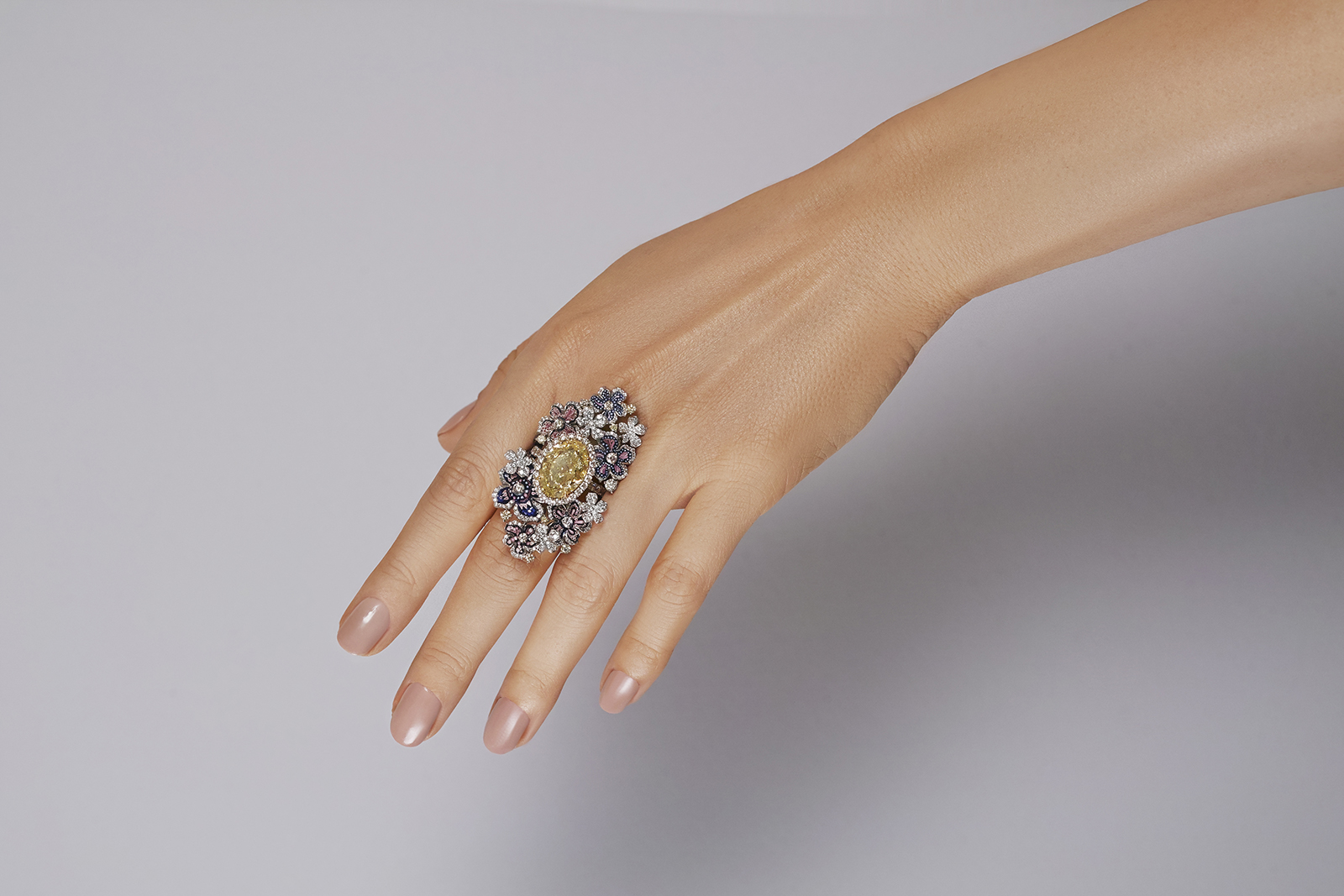 SICIS Secret Garden ring with a 7.66 carat fancy yellow diamond centre surrounded by micro-mosaics