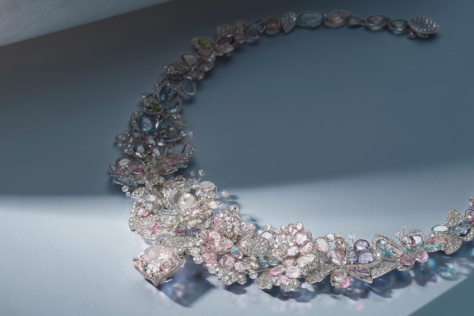 Feng J’s Jardin de Giverny necklace is set with rose-cut sapphires, spinels, tanzanites and tsavorites in pale shades of blue, purple, rose and green alongside a spectacular centrepiece: a rare 19 carat fancy cut light pink diamond