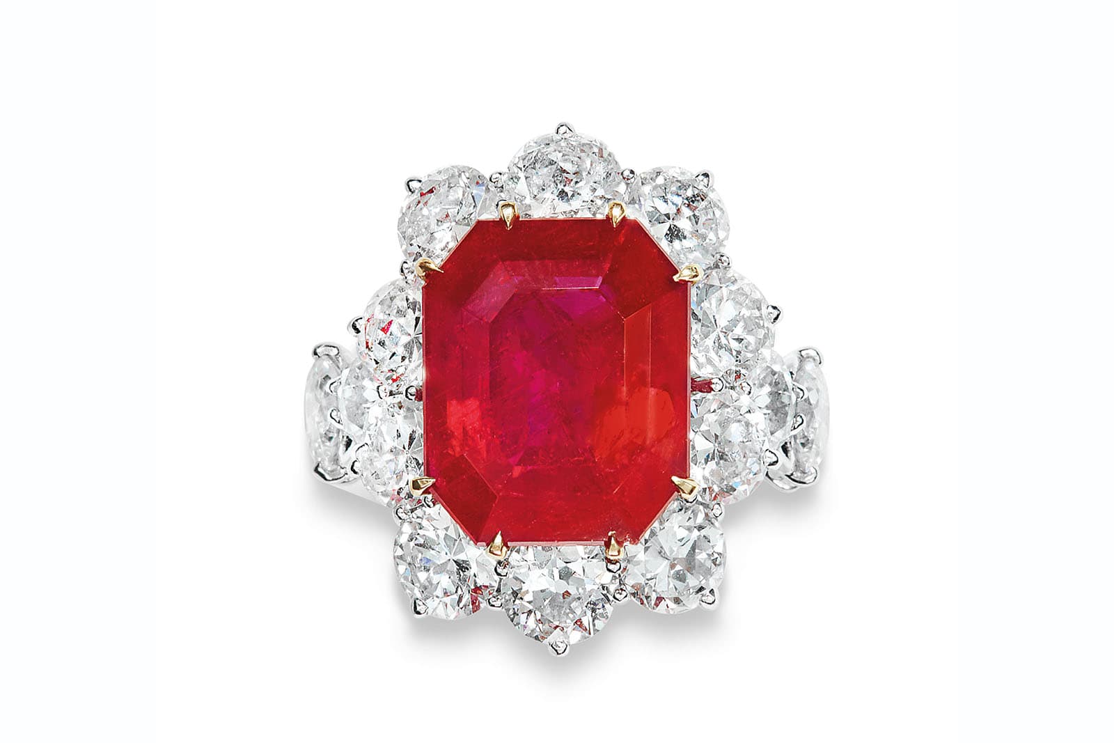 An octagonal step-cut Burmese ruby of 13.01 carats with old-cut diamonds, set into a ring by JAR