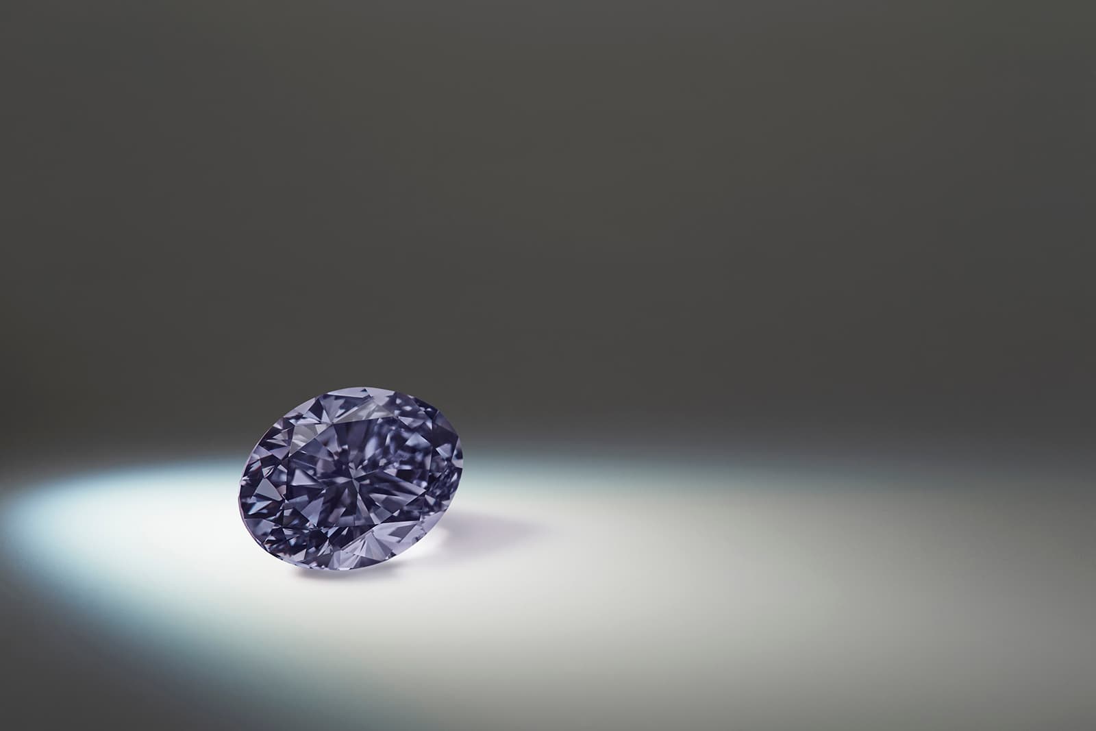  The Argyle Infinit, a 0.70 carat oval-shaped Fancy Dark Violet-Gray diamond from the 2020 Argyle Pink Diamond Tender