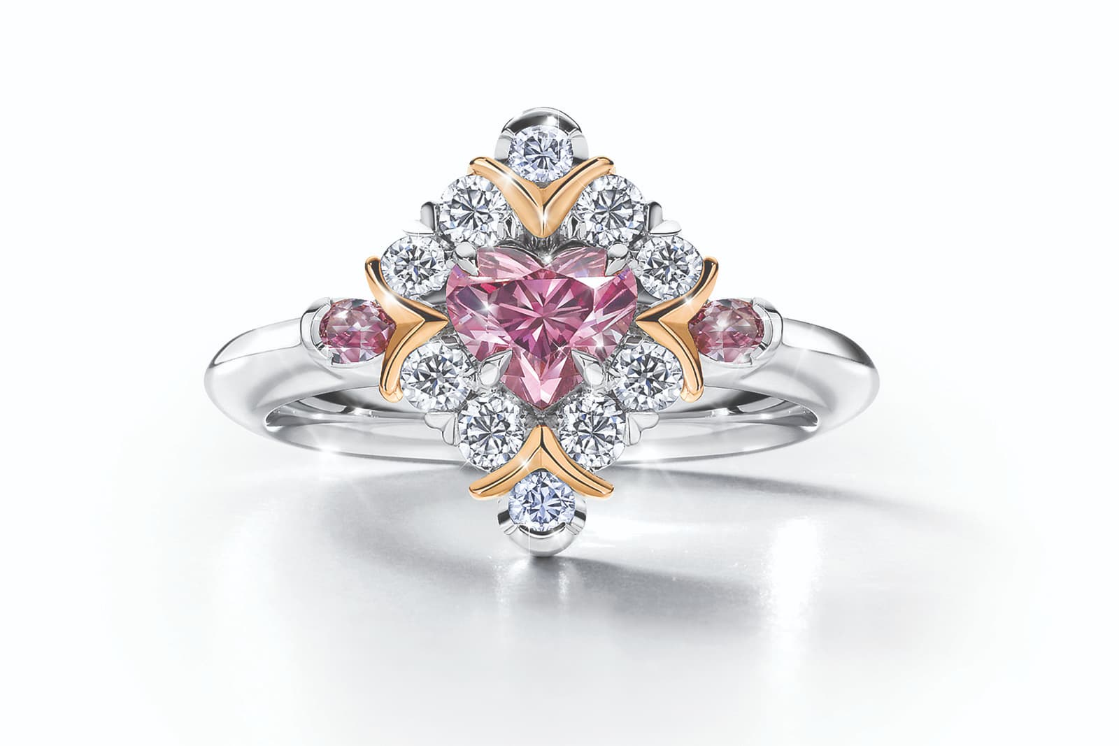  The Calleija Iamore heart-shaped diamond ring with a 0.56 carat purplish pink centre stone, two rare Argyle blue diamonds and white diamonds, in rose gold and platinum