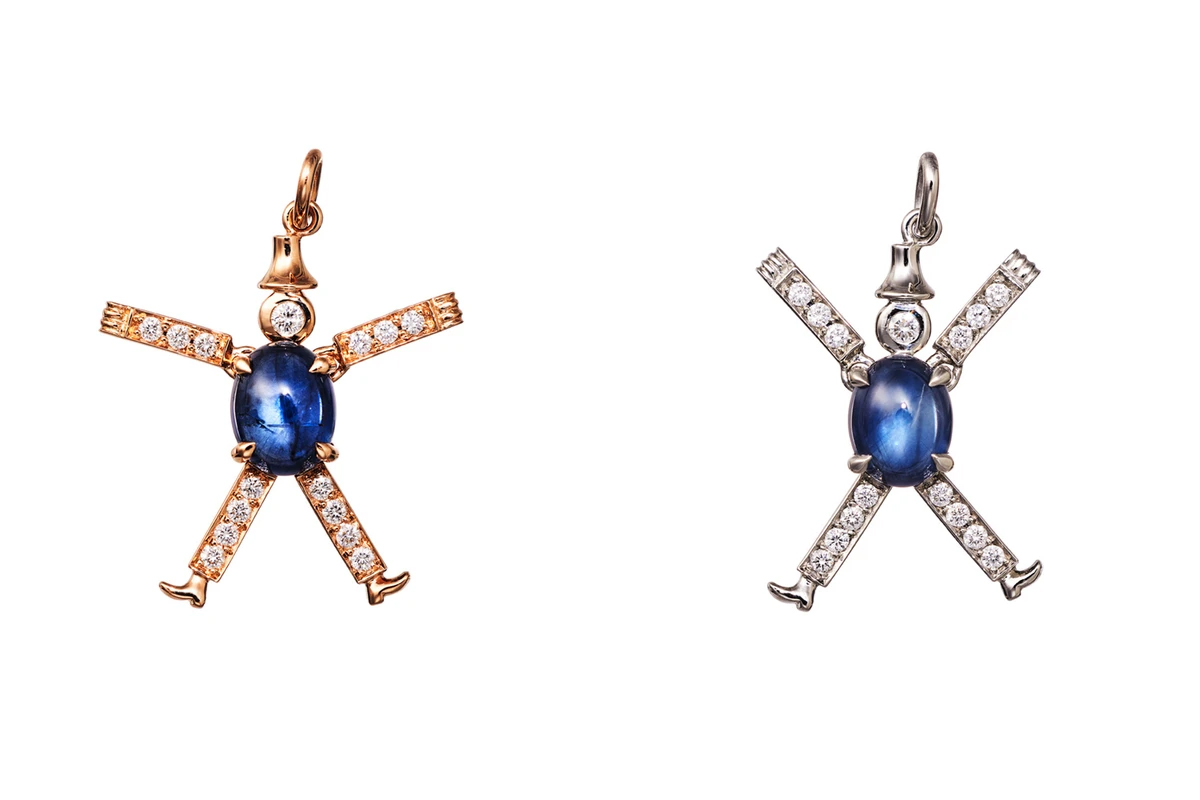  AENEA Jumping Jack charm pendants in rose gold and platinum with white diamonds and blue sapphire cabochons with Blue Sapphires