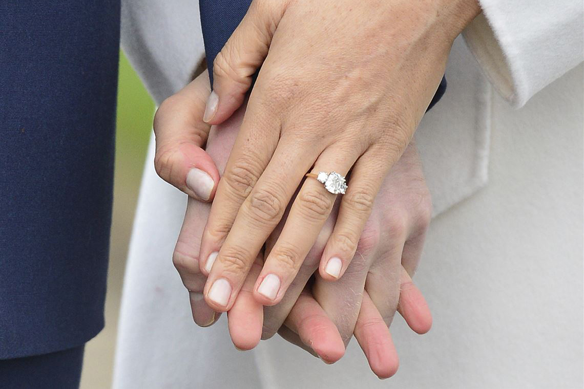 Meghan Markle's diamond trilogy engagement ring includes a central diamond from Botswana and two round brilliant diamonds from the collection of Princess Diana, crafted by court jeweller, Cleave & Co