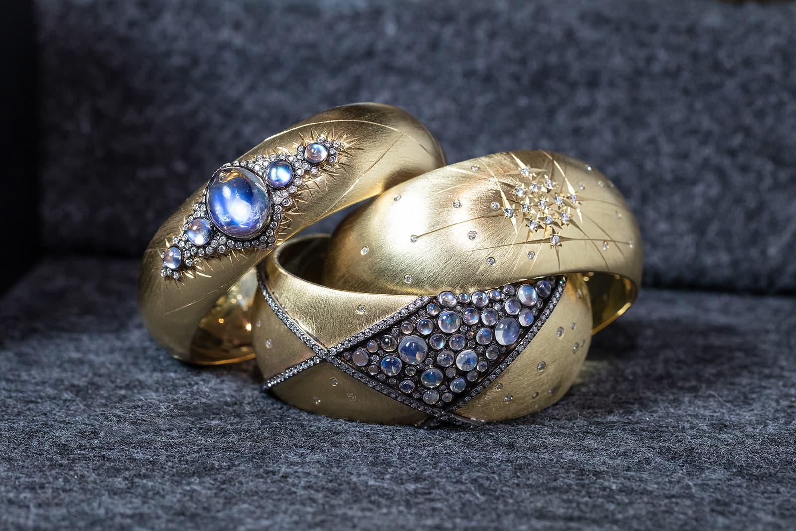 A trio of cuff bracelets from Adam Foster's Constellation Collection with diamonds and moonstones
