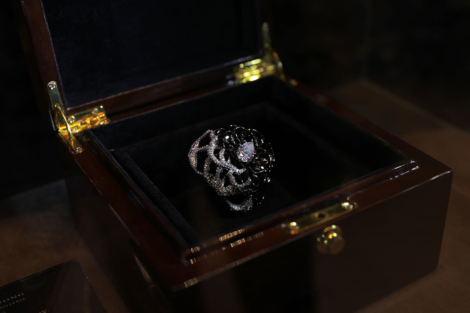  The Ming Song Haute Joaillerie Forbidden Flower IV ring is crafted with 520 pieces, each one a specific size and decorated with inlay
